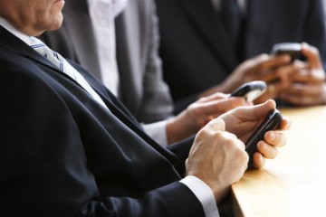 Businesspeople Using Their Cell Phones